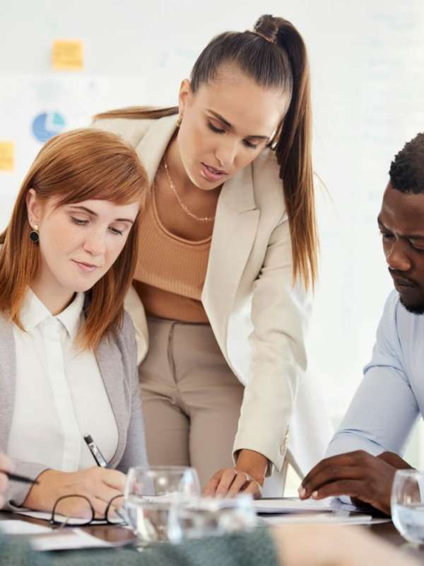 business-people-financial-and-meeting-at-a-table-with-serious-workers-planning-writing-and-prepar.jpg